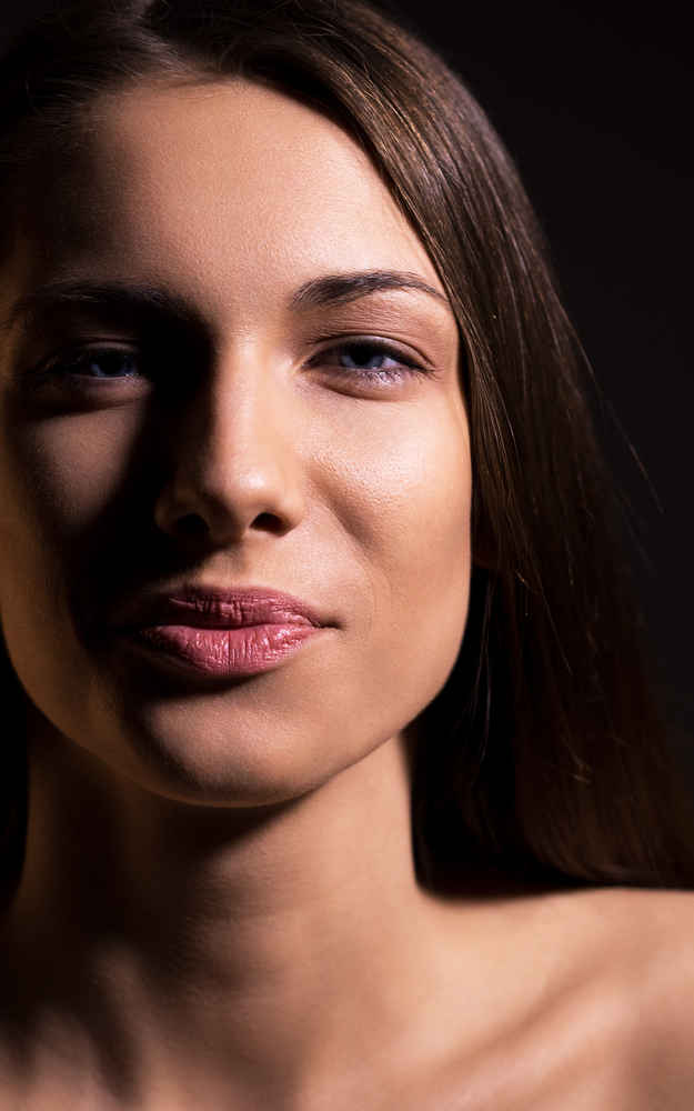 Woman showing her face after fat grafting surgery