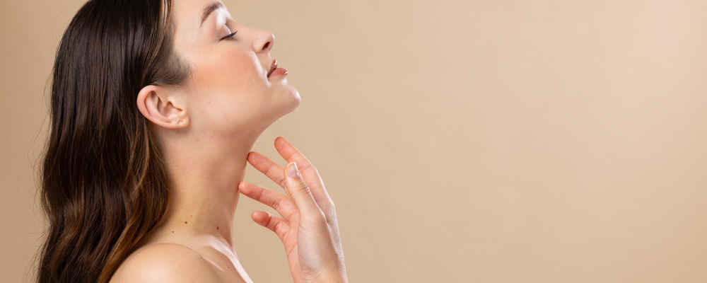 Side view of woman after liposuction surgery under the chin