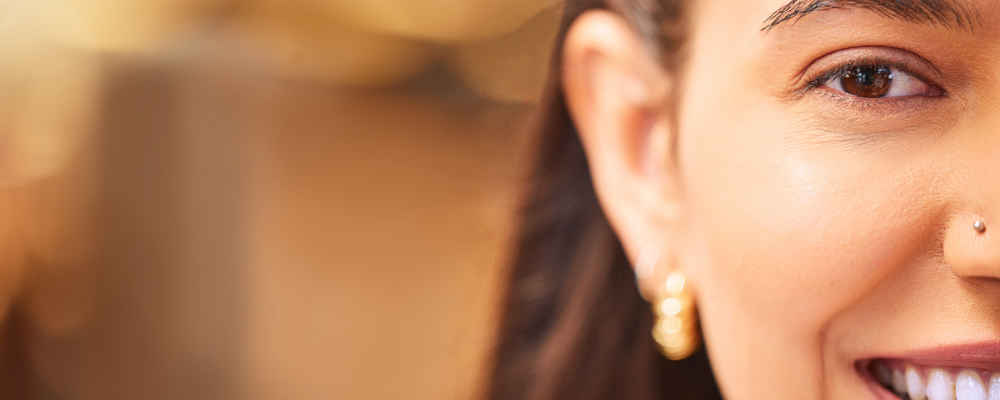 Woman before otoplasty ear pinning surgery