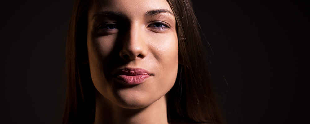 Woman showing her face after fat grafting surgery