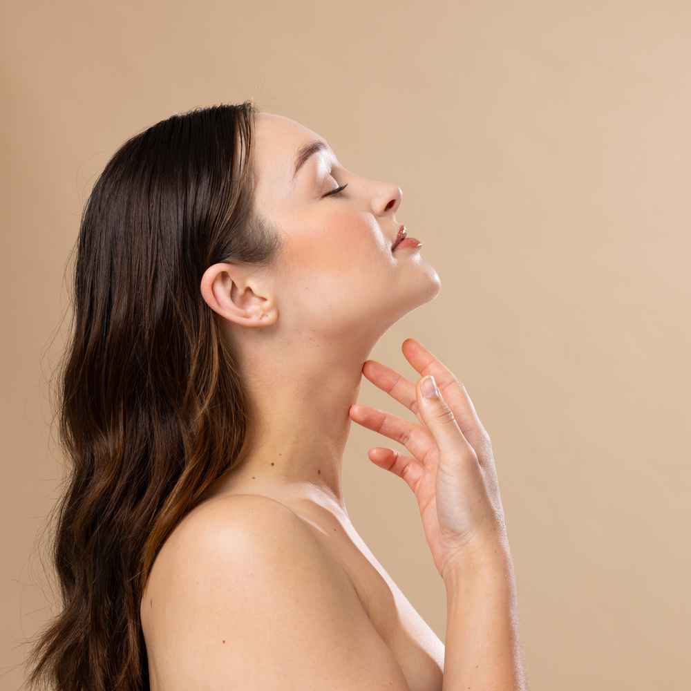 Side view of woman after liposuction surgery under the chin